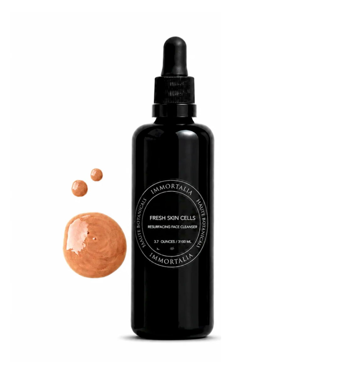 Black bottle of Immortalia Fresh Skin Cells with dropper on a white background